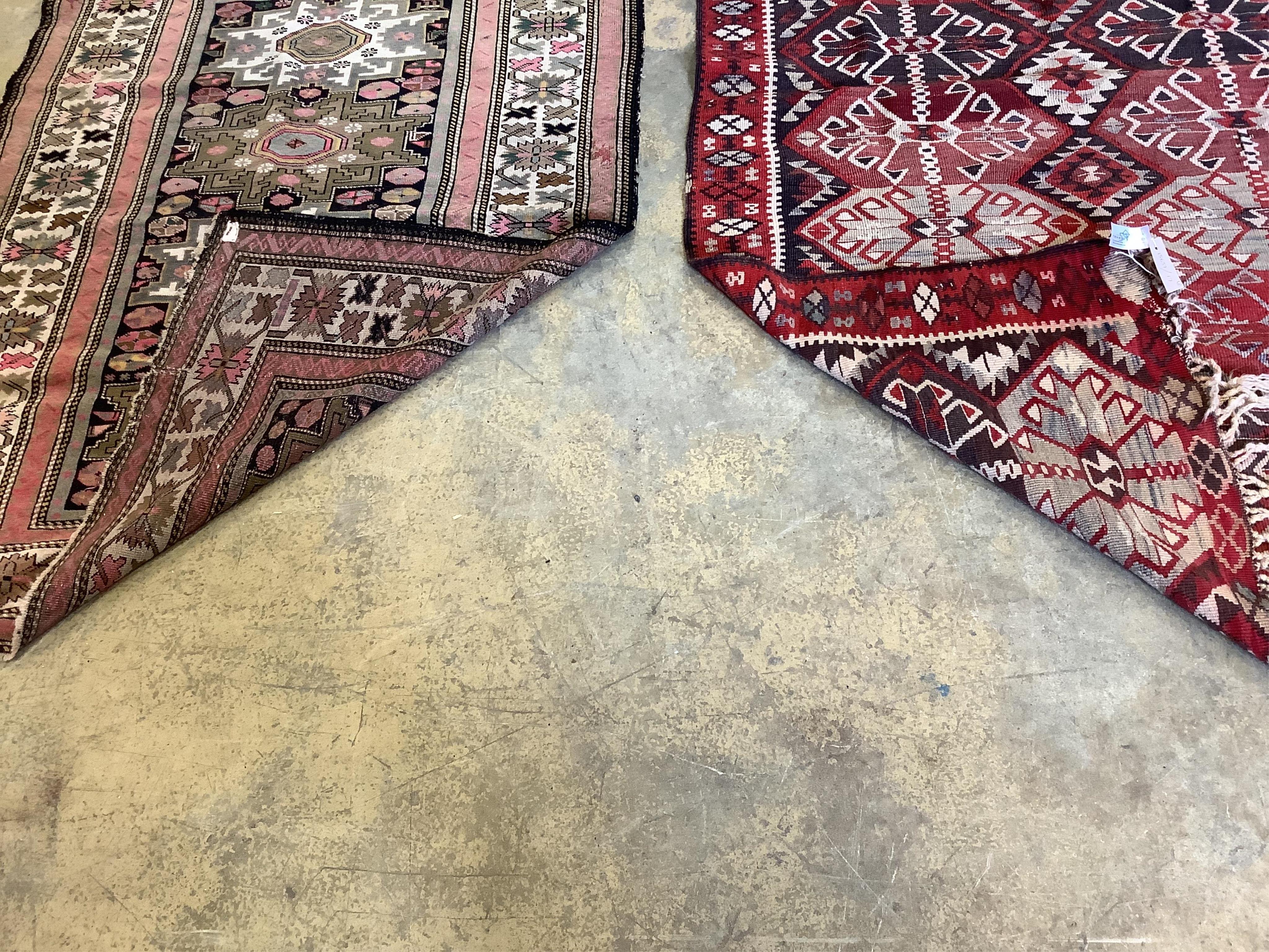 A Kelim rug and a Persian black ground rug, 190 x 105cm and 140 x 102cm. Condition - fair to good